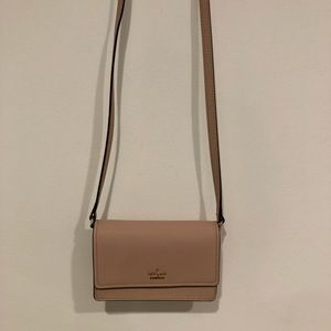 Light pink Kate Spade crossbody purse.